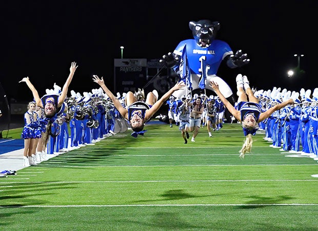Spring Hill (Texas) cheerleaders flip while leading the Panthers onto the field prior to the second half against Sabine.