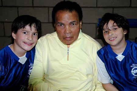 Ali surprised his grandsons - Biaggio (left) and Nico - by showing up for 
their youth basketball game in 2009.