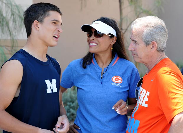 Biaggio Ali Walsh talks to his parents Rasheda Ali-Walsh and Bob Walsh after a recent game.