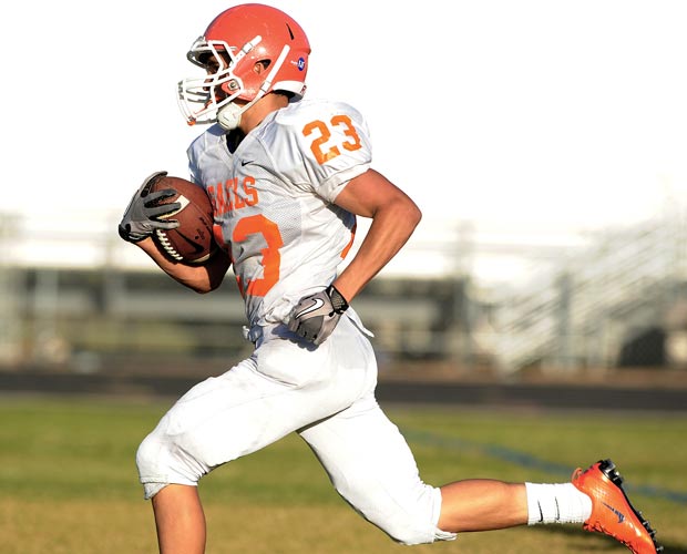 Biaggio Ali Walsh breaks into the open while scoring one of four touchdowns Wednesday.