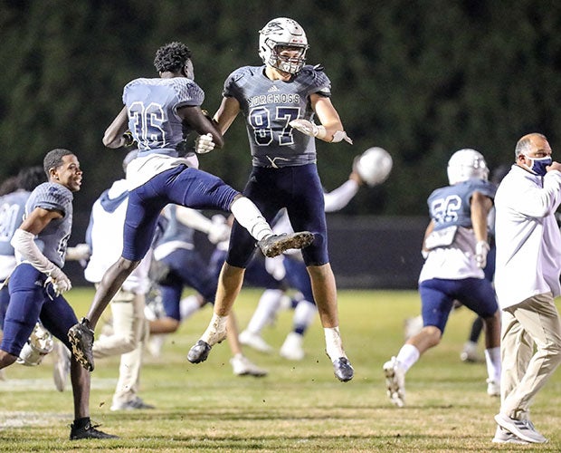 Lawson Luckie (87) and his teammates celebrate their victory over Colquitt County.