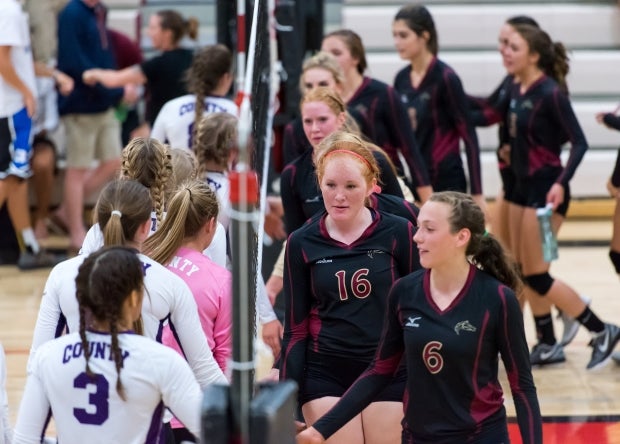 Douglas County and Ponderosa shake hands after a match last week.
