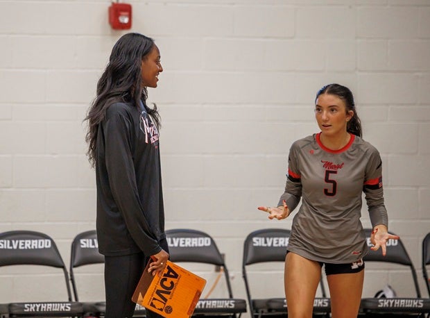 Marist assistant Cam Hannah talks with libero Elayna Davidson during a match at the Durango Fall Classic. Hannah, who won an NCAA title last season at Penn State, has come back to help her alma mater and coach Jordan Vidovic this year while she trains for her upcoming season with the Indy Ignite pro team. (PHOTO: Jenni Webber)
