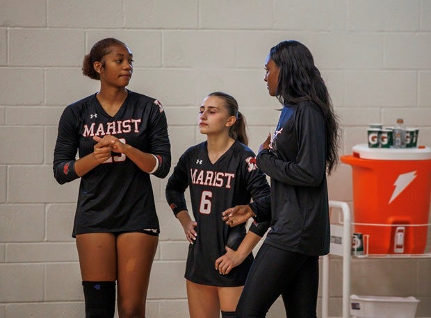 Marist coach said having former player and NCAA champion Cam Hannah as an assistant has been invaluable as the RedHawks try to repeat as Class 4A champions. (PHOTO: Jenni Webber)