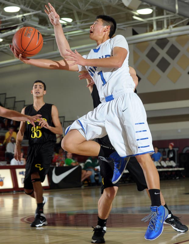 Irvington's Scott Ho drives to the basket during a 67-52 loss to Capistrano Valley in the Qwixcore Division.