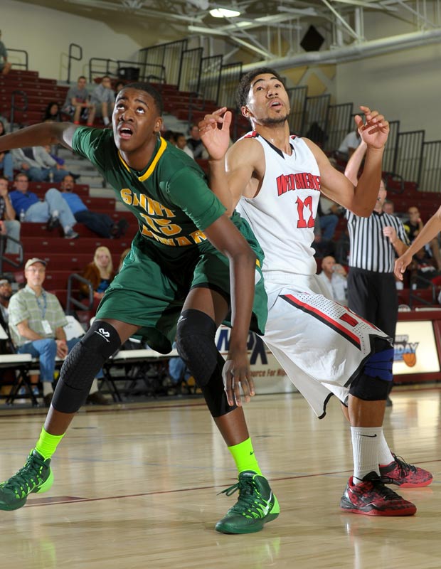 St. Edwards' Derek Funderburk (left) and Westchester's Nick Hamilton battle for position.