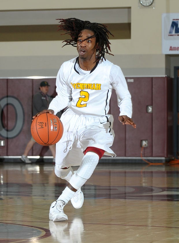 Cedric McGinnis (2) scored 20 points leading Wenonah to an 86-79 win over Tampa Catholic.