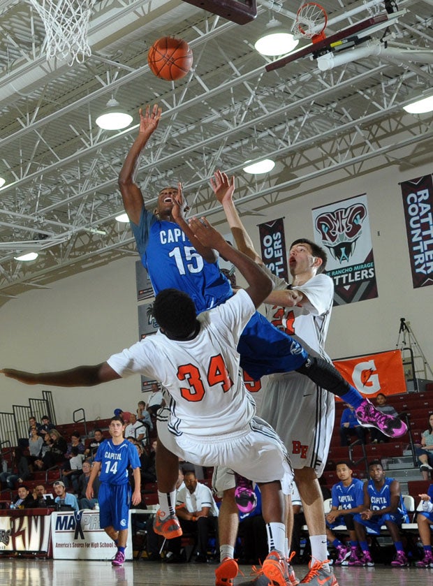 Capital Christian's Tiegen Jones goes high and knocks down Jalen Sands (34) in a 62-49 second-round win over Beverly Hills.