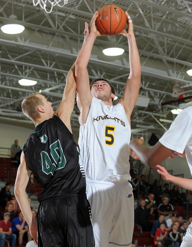 Columbia Christian's Arkadiy Mkrtychyan shoots over Jackson's Riley Waite during the Timberwolves' 68-48 victory.