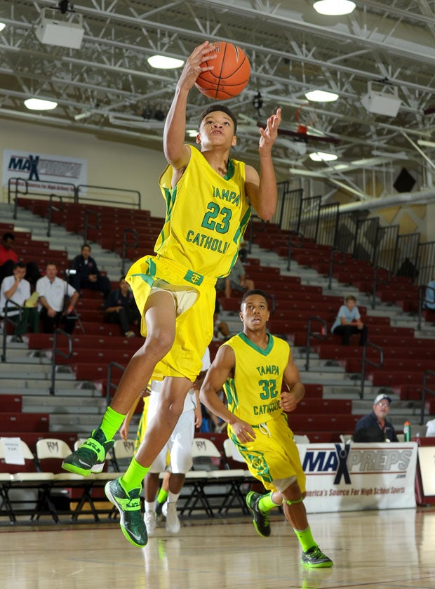Tampa Catholic's Sam Harris scores two of his 18 points in its loss to Wenonah.