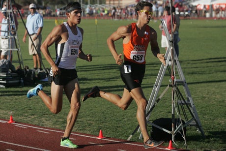 Cibola senior Bernie Montoya (in white) ends his high school career with three state track records in distance running.
