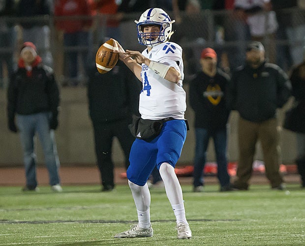 St. Xavier quarterback Sean Clifford drops back to pass during Saturday night's playoff game.