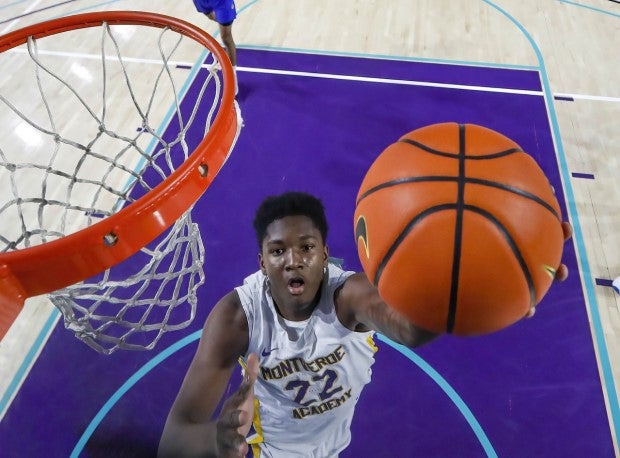 Five-star Class of 2024 prospect Derik Queen (22) goes up for the layup for Montverde Academy.