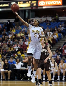 Freshman Aisia Robertson scores
two of her 13 points.