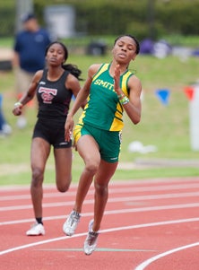 Texas-bound Courtney Okolo won her
third straight 400 on Friday in a
state-record time of 52.40.