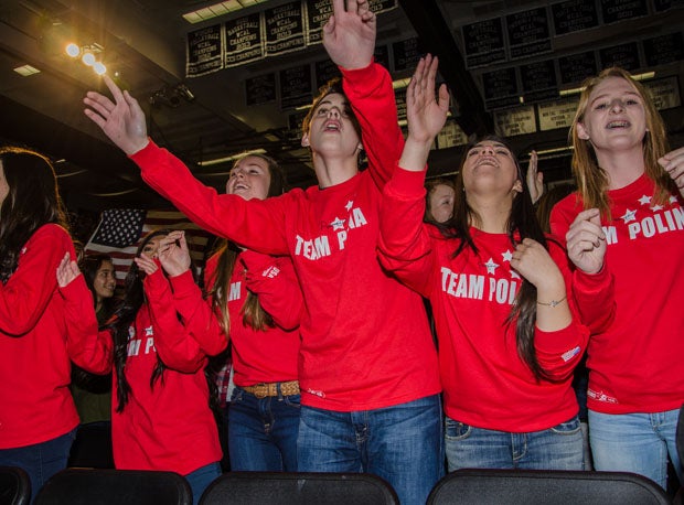 Team Polina, clad in bright red, flash their color and support in Friday's sendoff for Polina Edmunds at Mitty High School.