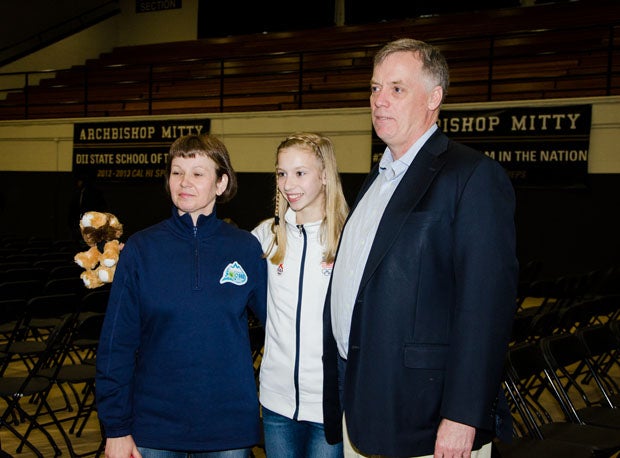 Polina Edmunds is flanked by her parents Nina and John Edmunds.