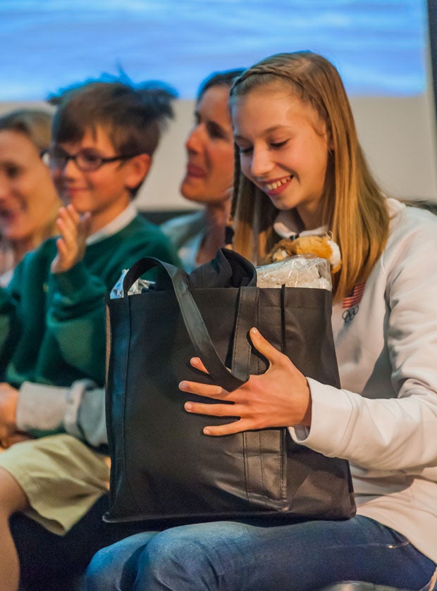 Mitty sophomore Polina Edmunds checks out a goodie bag given by her school's student body.