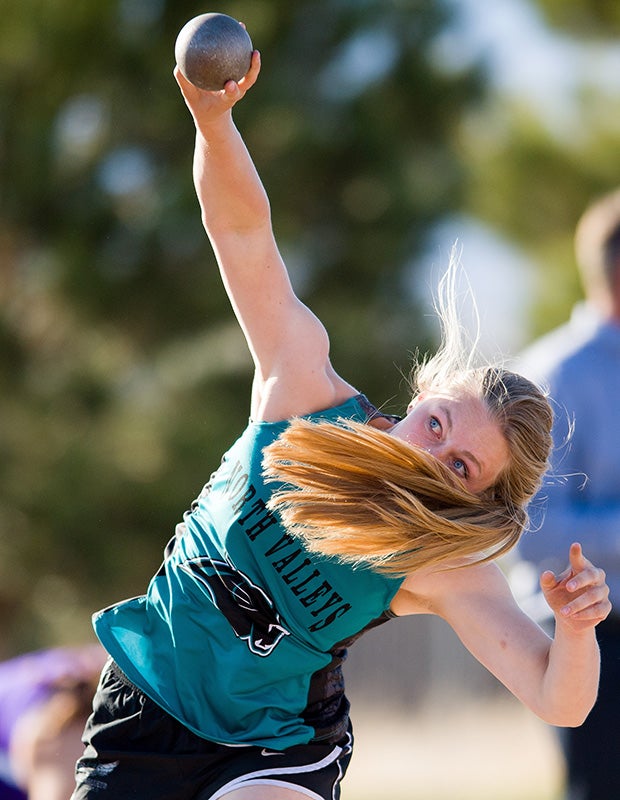 An athlete from North Valley (Nev.) competes in the women's shot put during the Fernley Invitational Track and Field Meet.