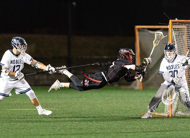 Brian Piatelli of St. Sebastian's School (Mass.) lays out for a shot against Noble & Greenough during the 1st Annual McCrae Williams Memorial game.    