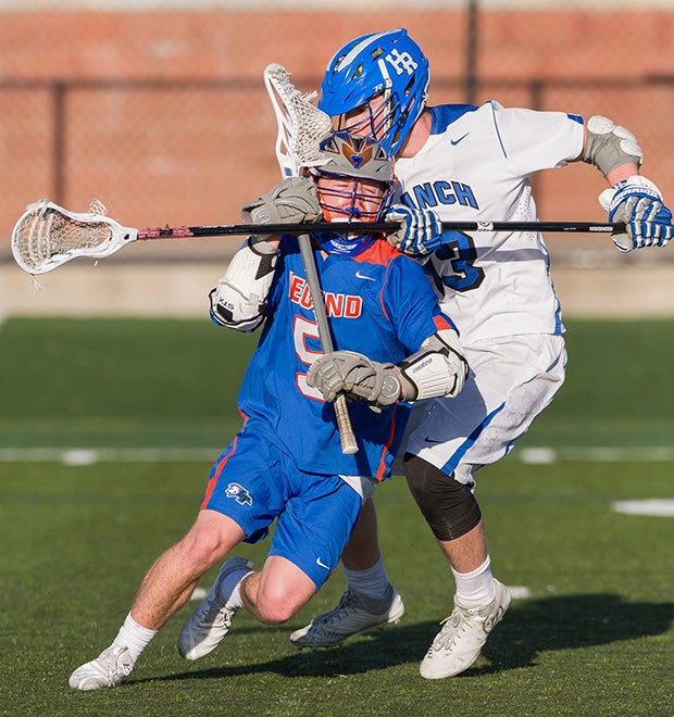 A Legend (left) and Highlands Ranch players battle for possession of the ball.