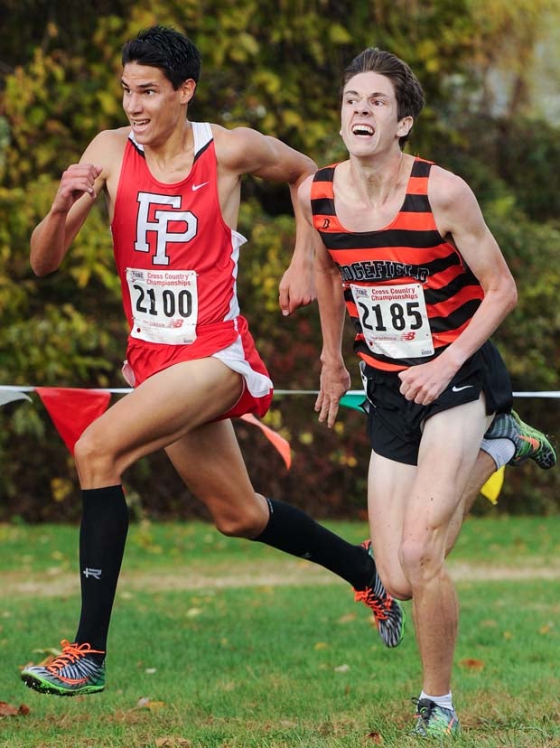 Christian Alvarado, left, and Trevor Hopper go down to the wire in boys race.