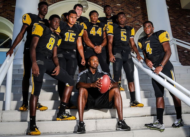 Head coach Mike Rumph (sitting) is surrounded by a wealth of talented players.