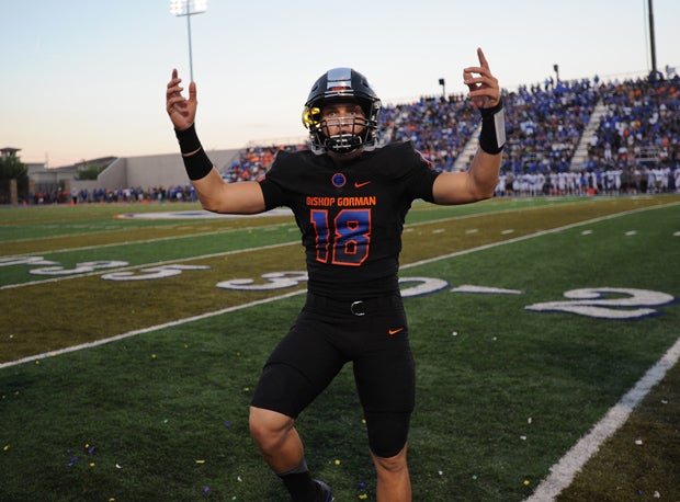 Bishop Gorman quarterback Tate Martell tries to pump up the crowd before the game.