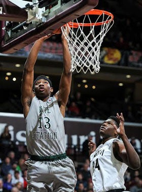 LaDarius Coleman goes up for two of his game-high 24 points Friday night against Paul VI.
