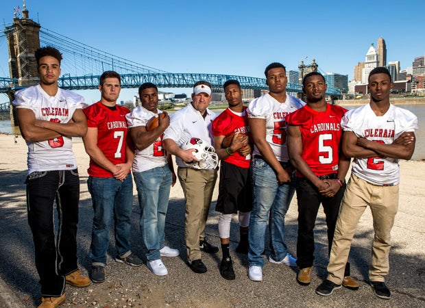 Head coach Tom Bolden is surrounded by a wealth of top recruits and has nine returning starters on defense alone. The Cincinnati skyline is shown in background. 