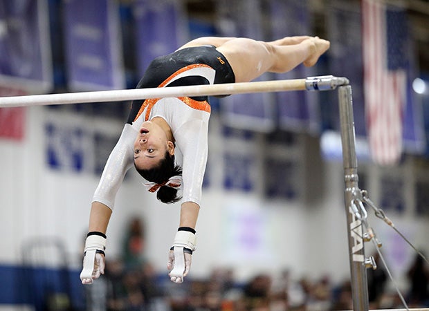 Amber Boll of Lakewood (Colo.) competes in the uneven bars during the CHSAA Gymnastics Championships.