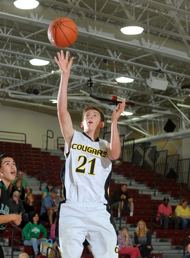Capistrano Valley's Keath Canning fires home two of his 10 points against Thousand Oaks.