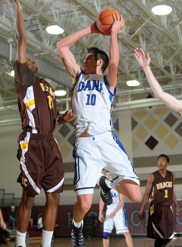 James Taylor (10) of Dana Hills with a heavily-guarded jumper in a 62-38 loss to El Camino.