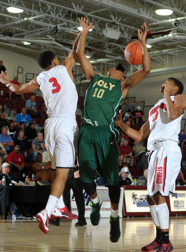 Long Beach Poly's Ke'jan Feagin (10) battles for a loose ball. 
