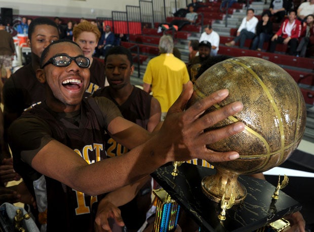 El Camino's Keith Dunham player enjoys the aftermath of his team's MaxPreps Holiday Classic title.