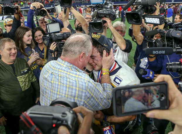 John Stephen Jones is embraced after the game by his dad and Executive Vice President, CEO, and Director of Player Personnel for the Dallas Cowboys, Stephen Jones. 