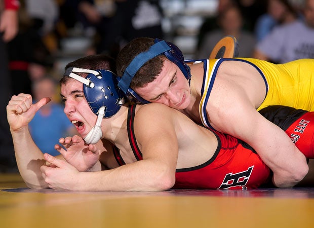 Paul Capobianco (top) of Northport battles Jack Scurti of Half Hollow Hills East during a match at the Suffolk League II Wrestling Tournament in February in New York.