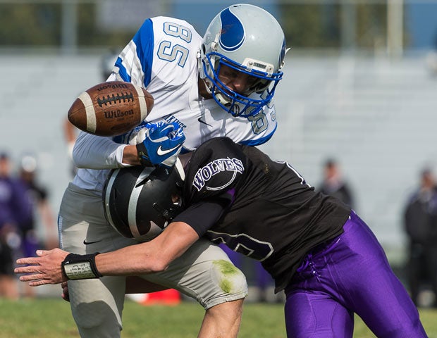 A Riverton defender causes a fumble while putting a hit on a Pleasant Grove player during a Utah junior varsity game in September.