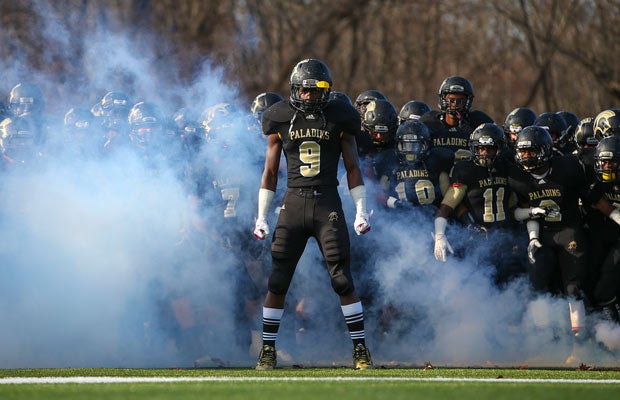 Paramus Catholic's Najee Clayton prepares to lead his teammates onto the field before their New Jersey showdown last November against visiting Don Bosco Prep in an NJSIAA Non-Public Group 4 semifinal game.