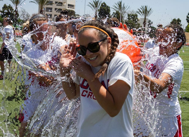 Los Alamitos lacrosse players celebrate by dousing their coach with water following a victory over Oak Park in the California Interscholastic Federation Southern Section championship game in May.