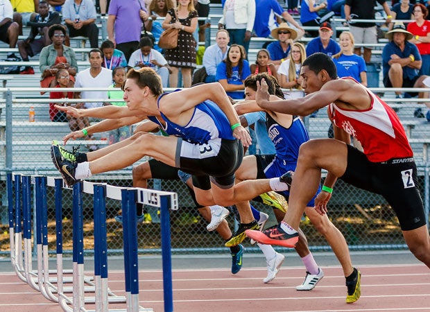 Competitors complete in a boys hurdles event during the California Interscholastic Federation Sac-Joaquin Section Track and Field Championships in May.
