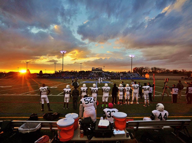 The sun sets during the Section 1 Class C football title game in New York between Rye Neck and Woodlands in November.