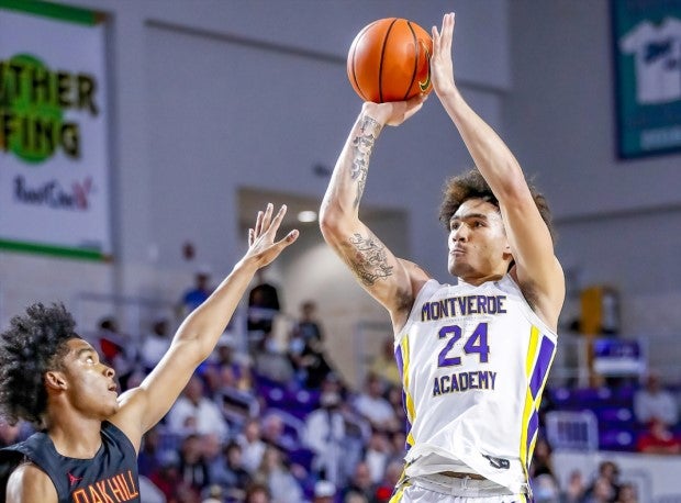 Indiana signee Jalen Hood-Schifino of Montverde Academy goes up for the jump shot over the outstretched arms of the defender.