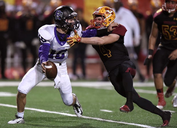 Quarterback Nick Acosta attempts to elude a Mission Viejo defender.
