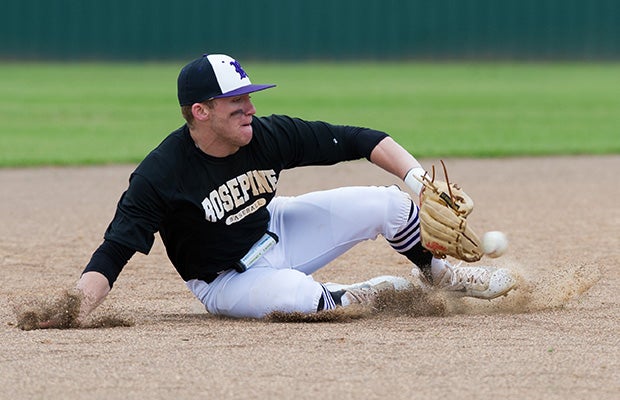 A Rosepine (La.) shortstop makes a sliding stop on a ground ball before getting up and throwing out the runner at first.