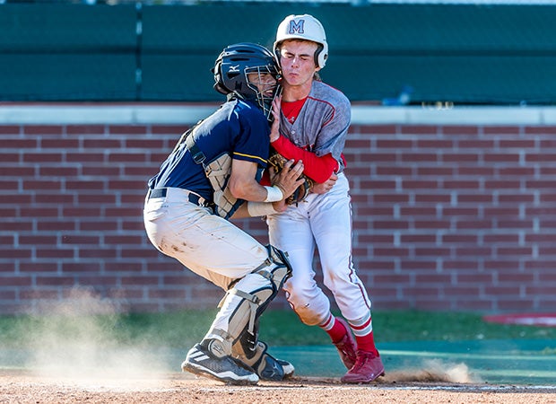 Jared Trozzo of Memorial (Texas) is tagged out at the plate by Cypress Ranch catcher Jared Alvarez-Lopez. 