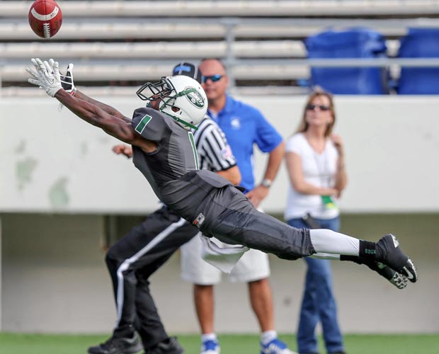 Central receiver Tavius Brown Jr. makes a leaping attempt to catch a pass.  