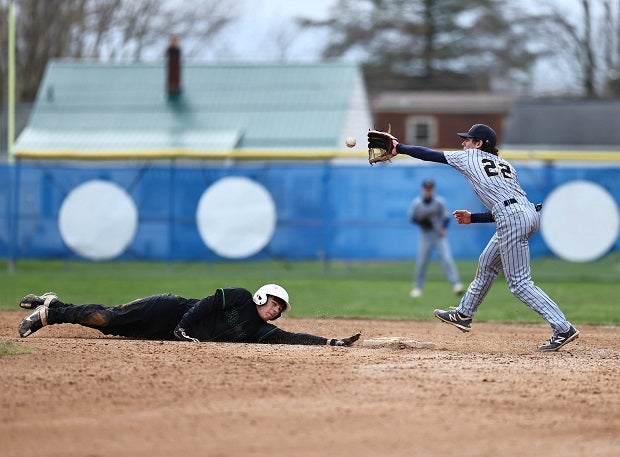 Shenango Freshman Trey Ross attempts to pick off a Riverside baserunner. (Photo: Mary Perry)