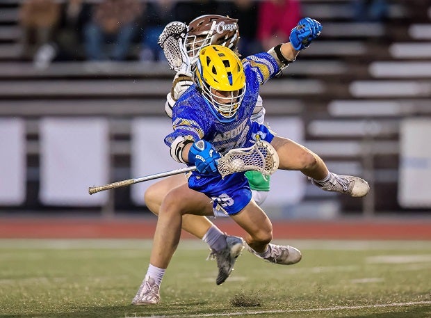 Agoura face-off/get-off specialist Gavin Horowitz gets checked hard during non-league play against Crespi. (Photo: Jace Kessler)