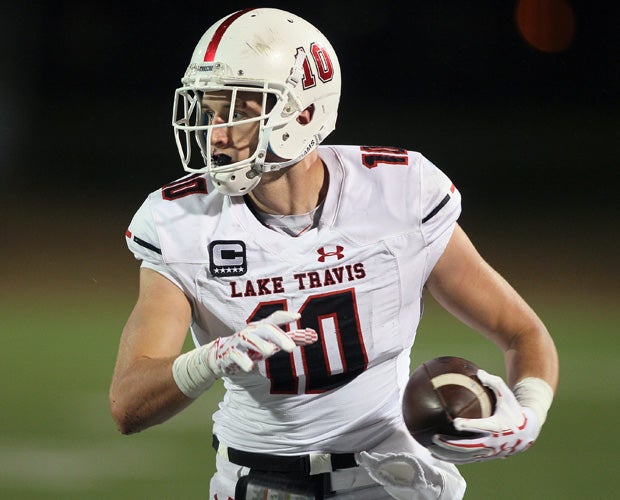 Lake Travis receiver/tight end Cade Brewer carries during Friday nights's playoff victory over Westlake.